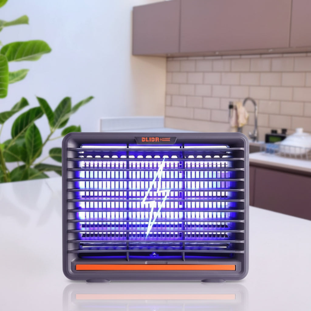 Insect zapper on a kitchen counter with a person preparing food in the background